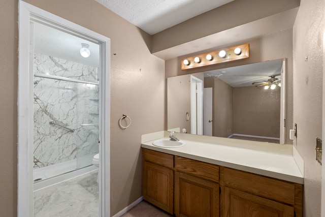 2413 38th Ave N, Texas City, TX 77590 - full bath featuring a marble finish shower, vanity, toilet, and ceiling fan