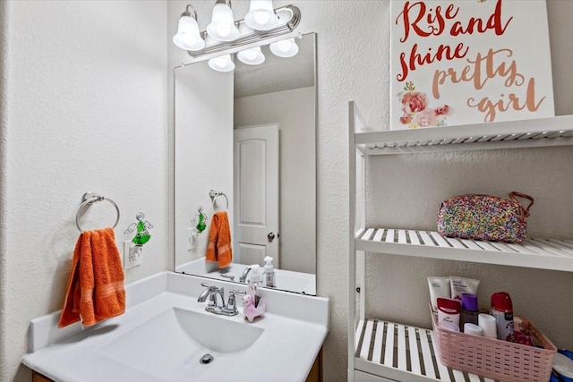 2506 Solitude, Deer Park, TX 77536 - bathroom featuring vanity, a textured wall, and a chandelier