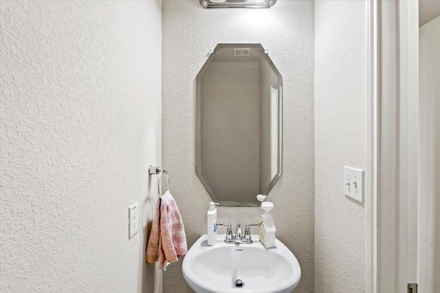 2506 Solitude, Deer Park, TX 77536 - bathroom featuring a sink and a textured wall