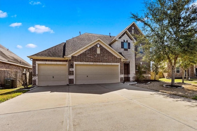 2506 Solitude, Deer Park, TX 77536 - view of front of property with brick siding, an attached garage, roof with shingles, and driveway