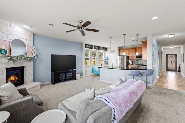 2506 Solitude, Deer Park, TX 77536 - living area featuring ceiling fan, light carpet, a fireplace, recessed lighting, and baseboards