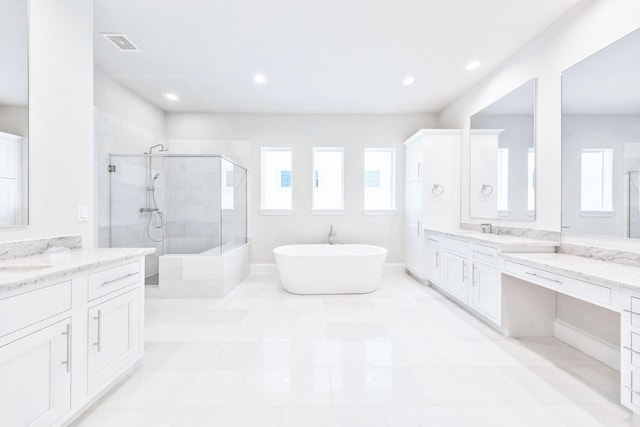 1008 Golden Nectar, Houston, TX 77008 - full bathroom with a shower stall, two vanities, a soaking tub, and recessed lighting