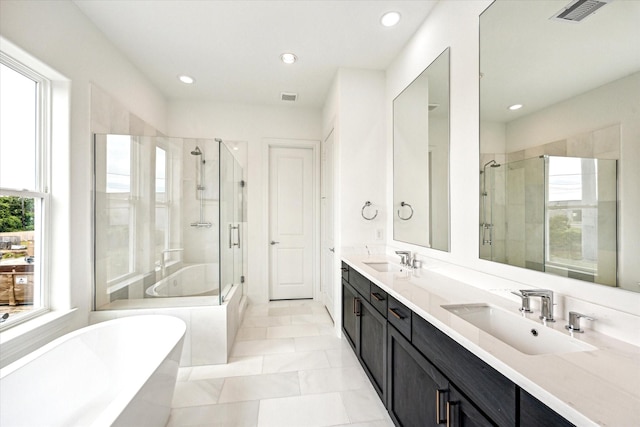 1008 Golden Nectar, Houston, TX 77008 - full bathroom with a freestanding tub, a stall shower, double vanity, and recessed lighting