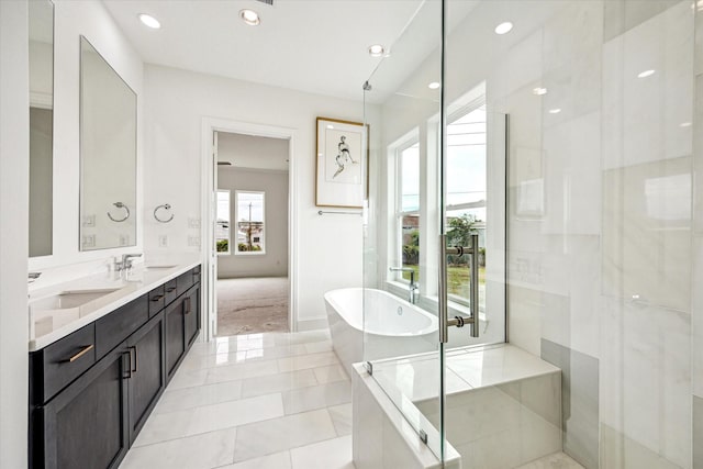 1008 Golden Nectar, Houston, TX 77008 - full bath featuring a freestanding tub, double vanity, a shower with door, and recessed lighting