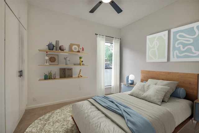 1100 Augusta Dr Unit 33, Houston, TX 77057 - tiled bedroom featuring ceiling fan and baseboards
