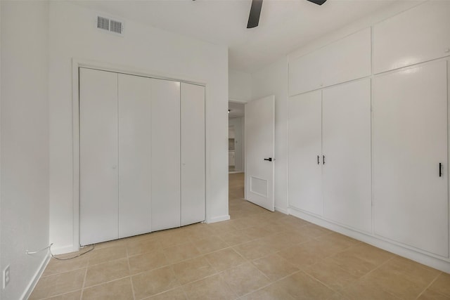 1100 Augusta Dr Unit 33, Houston, TX 77057 - unfurnished bedroom with light tile patterned floors and a ceiling fan