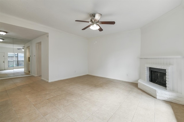 1100 Augusta Dr Unit 33, Houston, TX 77057 - unfurnished living room featuring a ceiling fan, light tile patterned floors, a fireplace, ornamental molding, and baseboards