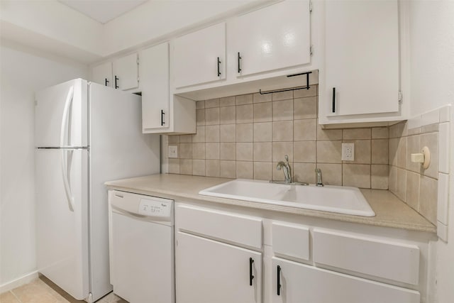 1100 Augusta Dr Unit 33, Houston, TX 77057 - kitchen with white appliances, a sink, light countertops, and white cabinetry
