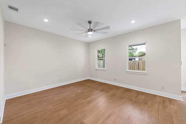 4224 Buck St, Houston, TX 77020 - unfurnished room featuring ceiling fan, baseboards, light wood-style flooring, and recessed lighting