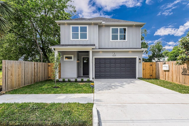 4224 Buck St, Houston, TX 77020 - view of front of house with board and batten siding, an attached garage, driveway, and a gate