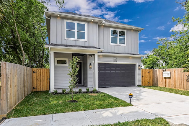 4224 Buck St, Houston, TX 77020 - view of front facade featuring board and batten siding, a garage, driveway, and a gate