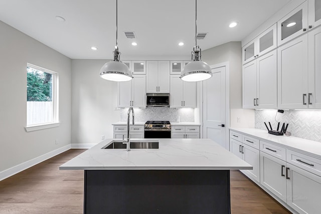4224 Buck St, Houston, TX 77020 - kitchen with appliances with stainless steel finishes, a sink, recessed lighting, backsplash, and pendant lighting