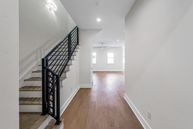 4224 Buck St, Houston, TX 77020 - staircase with a ceiling fan, wood finished floors, baseboards, and recessed lighting