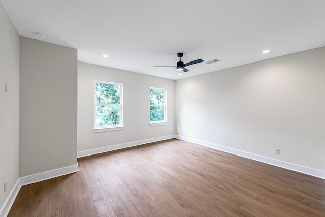 4224 Buck St, Houston, TX 77020 - empty room featuring dark wood-style flooring, baseboards, ceiling fan, and recessed lighting