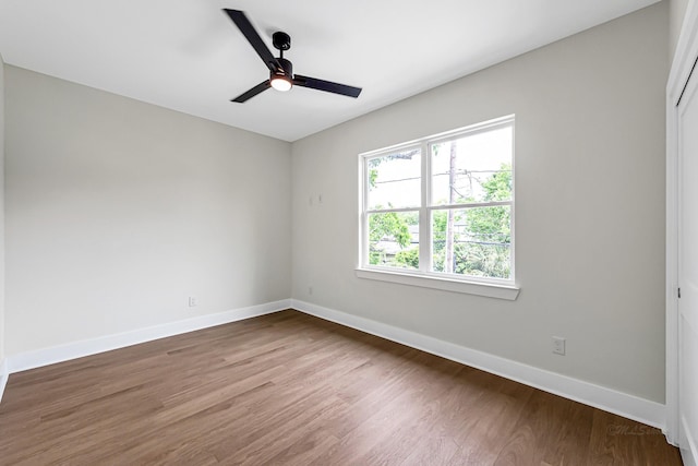 4224 Buck St, Houston, TX 77020 - unfurnished room with dark wood-style floors, baseboards, and a ceiling fan