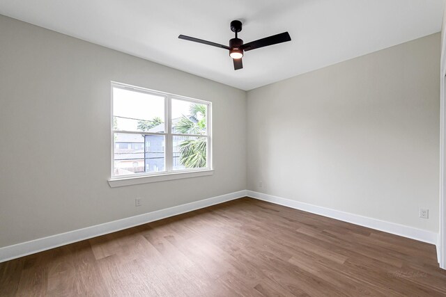 4224 Buck St, Houston, TX 77020 - spare room featuring dark wood-style floors, ceiling fan, and baseboards