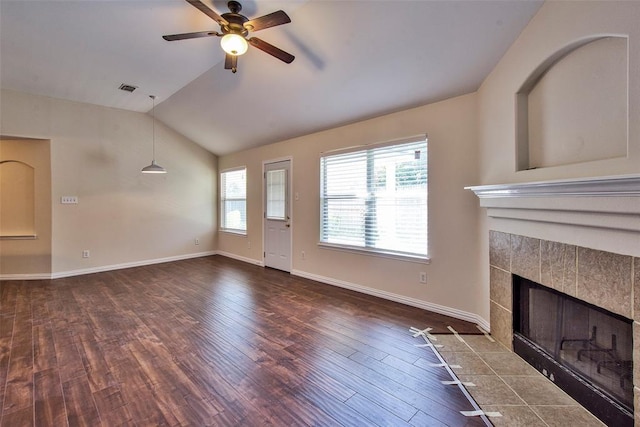 19511 Ingham Dr, Katy, TX 77449 - unfurnished living room featuring ceiling fan, dark wood-style flooring, lofted ceiling, baseboards, and a fireplace