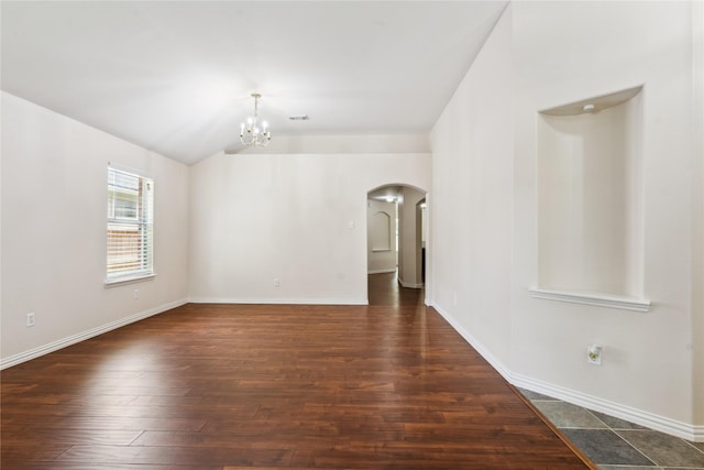 19511 Ingham Dr, Katy, TX 77449 - spare room with arched walkways, a chandelier, lofted ceiling, and wood finished floors