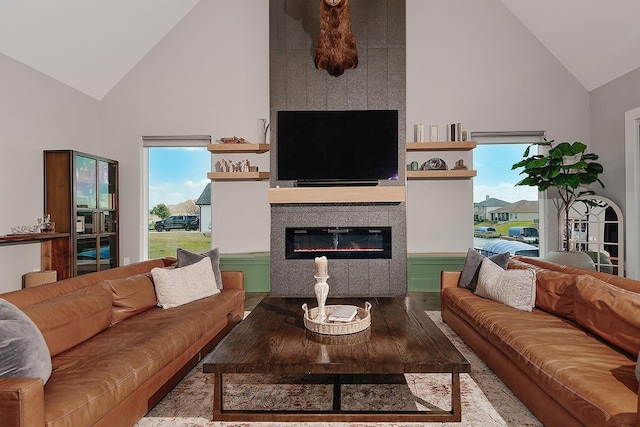 12595 St Louis Ct, Willis, TX 77318 - living area with high vaulted ceiling, wood finished floors, and a fireplace