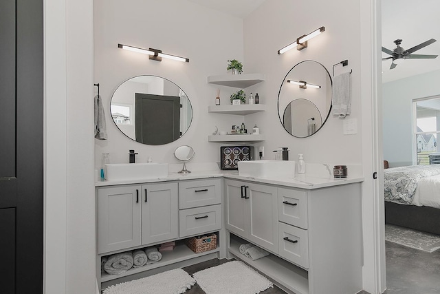12595 St Louis Ct, Willis, TX 77318 - ensuite bathroom featuring double vanity, a ceiling fan, and concrete flooring