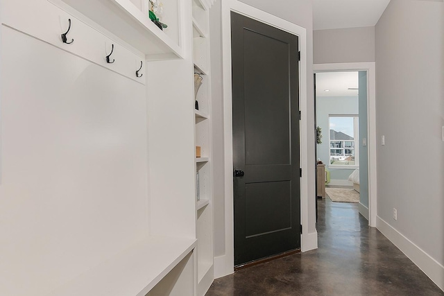 12595 St Louis Ct, Willis, TX 77318 - mudroom featuring concrete flooring and baseboards