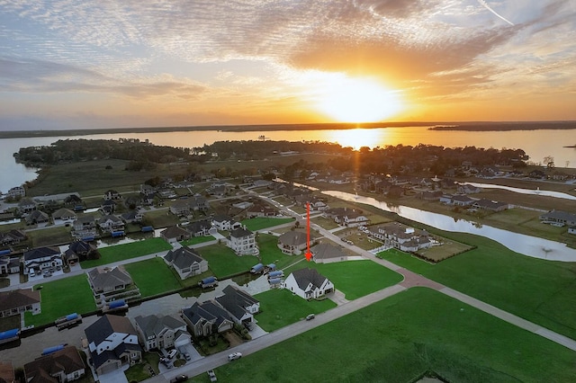 12595 St Louis Ct, Willis, TX 77318 - aerial view at dusk of a water view and a residential view