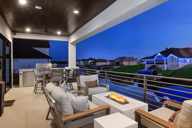 12595 St Louis Ct, Willis, TX 77318 - view of patio with an outdoor living space with a fire pit, grilling area, a balcony, and a residential view