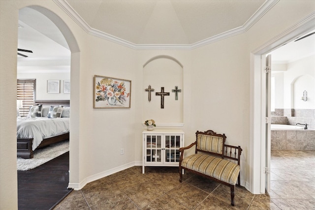 8718 Stowe Creek Ln, Missouri City, TX 77459 - living area featuring ornamental molding, arched walkways, tile patterned floors, a ceiling fan, and baseboards
