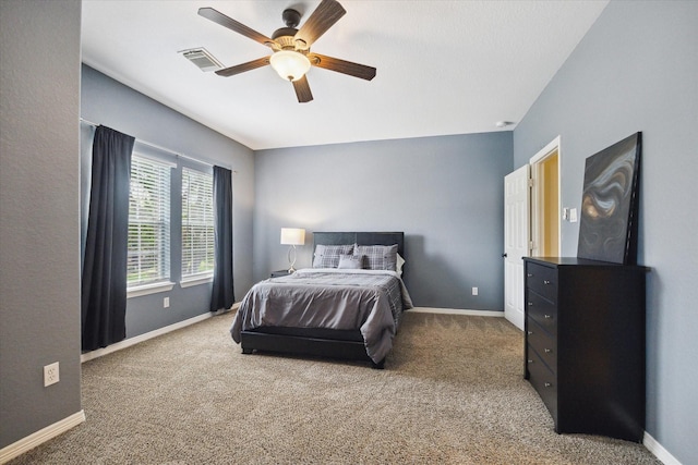 8718 Stowe Creek Ln, Missouri City, TX 77459 - carpeted bedroom featuring baseboards and ceiling fan