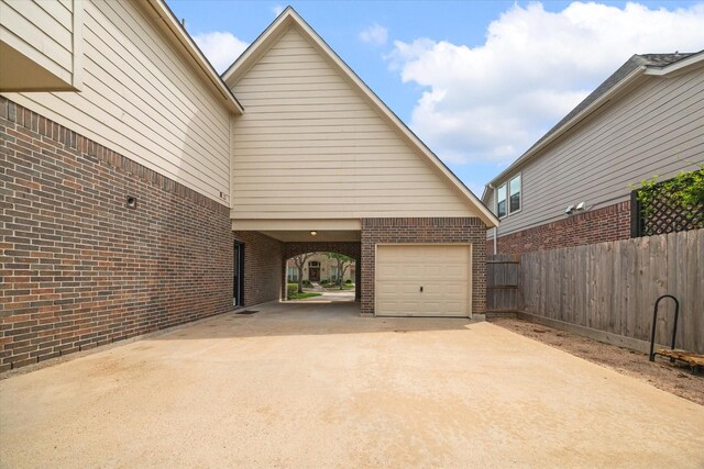 8718 Stowe Creek Ln, Missouri City, TX 77459 - view of property exterior featuring driveway, brick siding, and a garage
