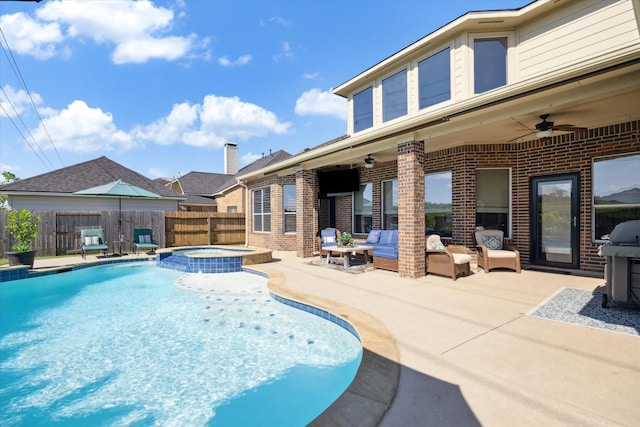 8718 Stowe Creek Ln, Missouri City, TX 77459 - view of pool with a ceiling fan, a patio, a fenced backyard, a pool with connected hot tub, and outdoor lounge area