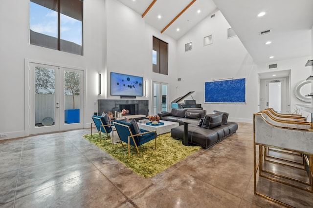 4102 Coleridge, West University Place, TX 77005 - living room with high vaulted ceiling, finished concrete floors, baseboards, french doors, and recessed lighting
