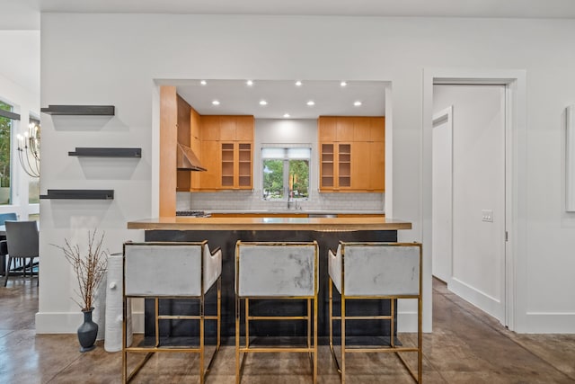 4102 Coleridge, West University Place, TX 77005 - kitchen with open shelves, recessed lighting, backsplash, finished concrete floors, and a kitchen breakfast bar