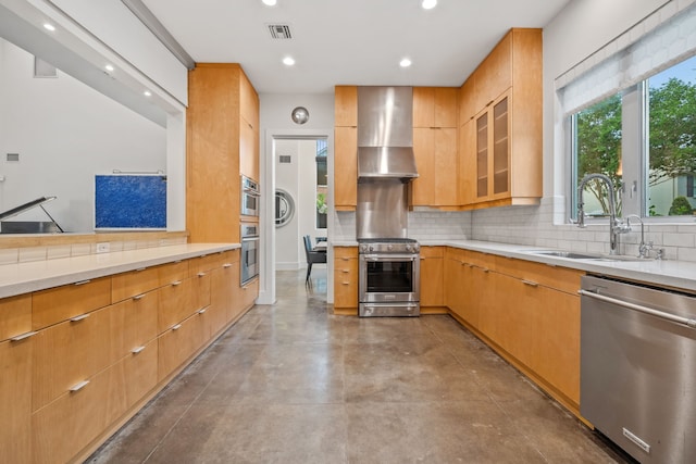 4102 Coleridge, West University Place, TX 77005 - kitchen with appliances with stainless steel finishes, wall chimney range hood, recessed lighting, a sink, and tasteful backsplash