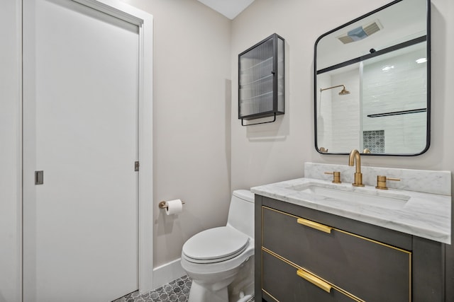 4102 Coleridge, West University Place, TX 77005 - full bath featuring toilet, vanity, a tile shower, and baseboards