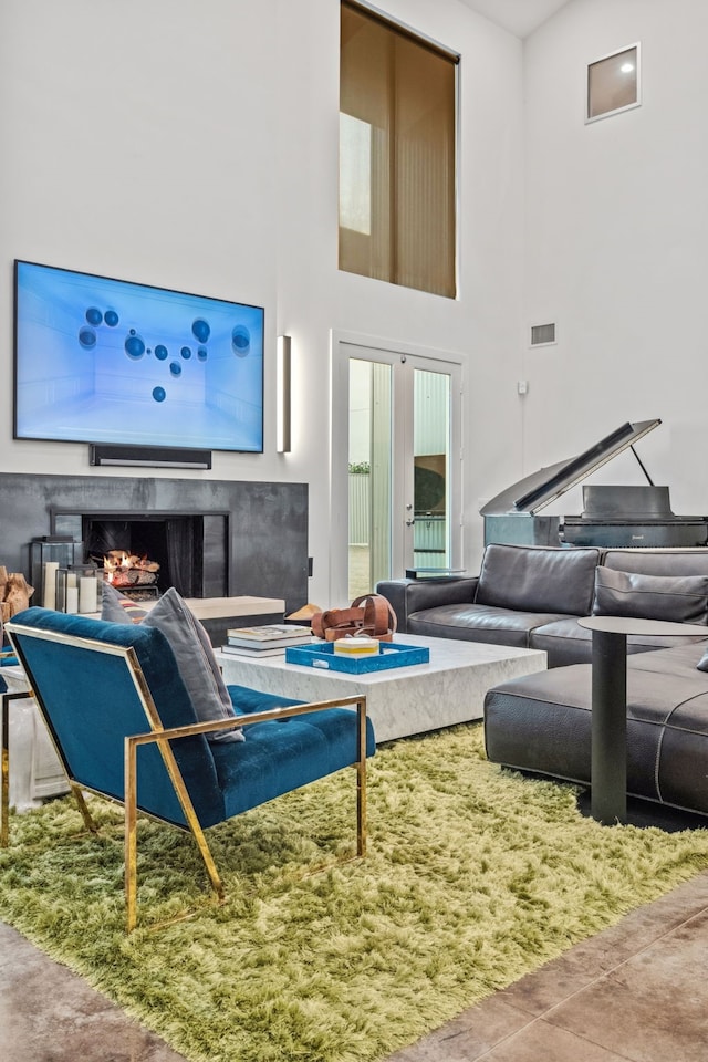 4102 Coleridge, West University Place, TX 77005 - living room with a warm lit fireplace, a towering ceiling, and plenty of natural light