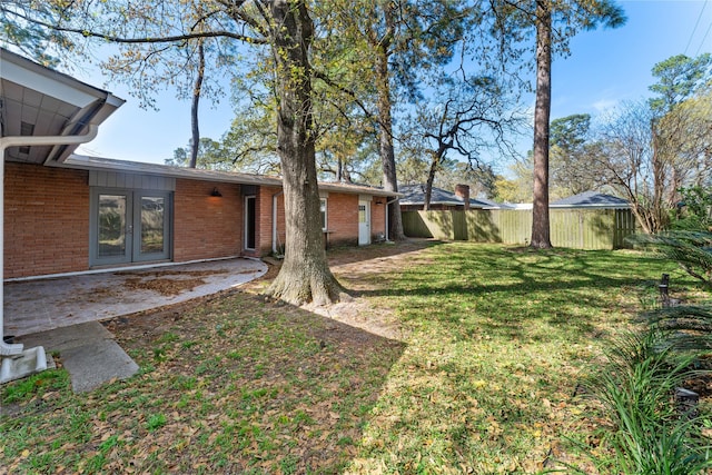 10134 Hanka Dr, Houston, TX 77043 - view of yard featuring french doors