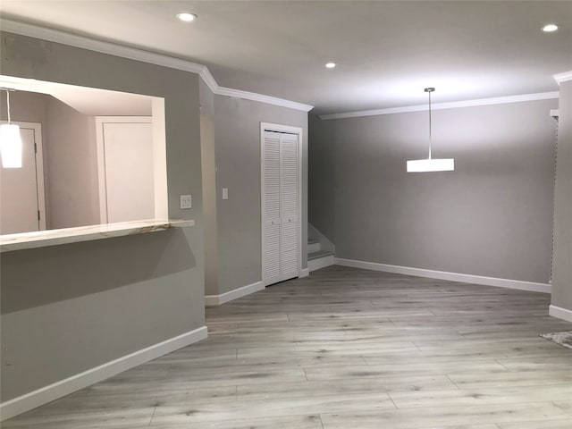 17202 Imperial Valley Dr Unit 16, Houston, TX 77060 - empty room featuring crown molding, baseboards, recessed lighting, light wood finished floors, and stairway