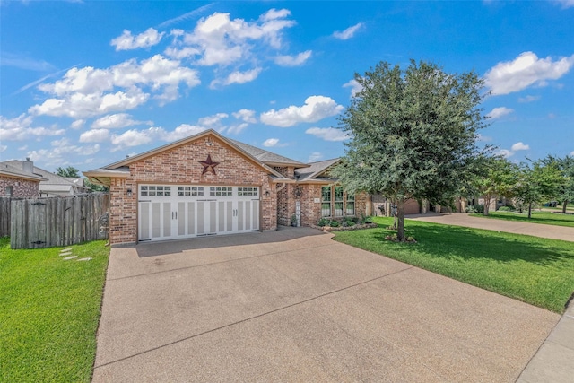 911 Dove Run Trl, College Station, TX 77845 - view of front facade with concrete driveway, brick siding, and an attached garage