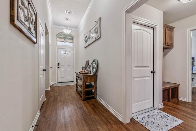 911 Dove Run Trl, College Station, TX 77845 - entryway featuring dark wood-style floors, crown molding, and baseboards