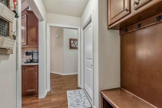 911 Dove Run Trl, College Station, TX 77845 - mudroom featuring light wood-style floors and baseboards