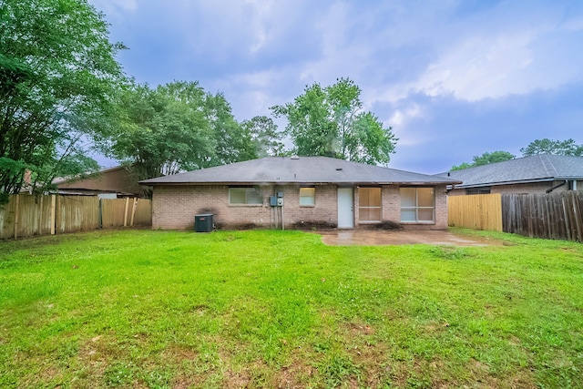 8006 Barnhill Dr, Humble, TX 77338 - back of house featuring a patio, cooling unit, and brick siding
