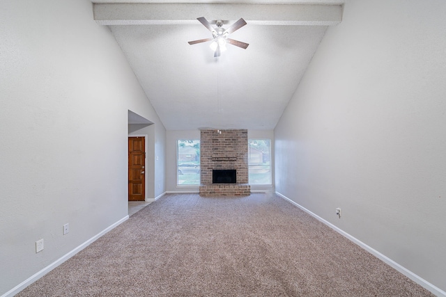 8006 Barnhill Dr, Humble, TX 77338 - unfurnished living room with carpet flooring, ceiling fan, a fireplace, baseboards, and vaulted ceiling