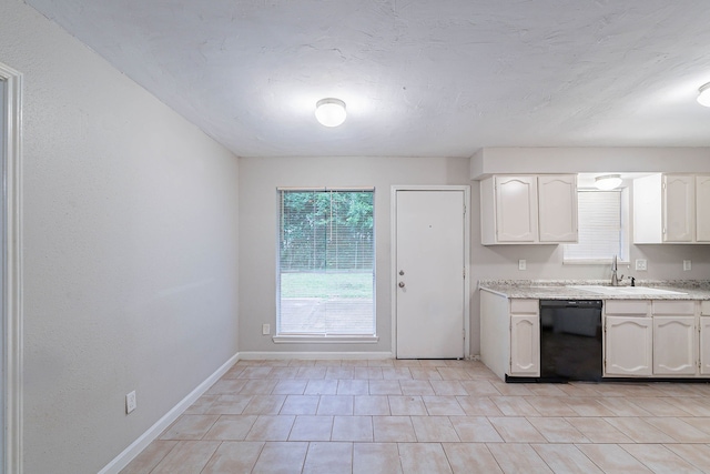 8006 Barnhill Dr, Humble, TX 77338 - kitchen featuring dishwasher, baseboards, white cabinetry, and a sink