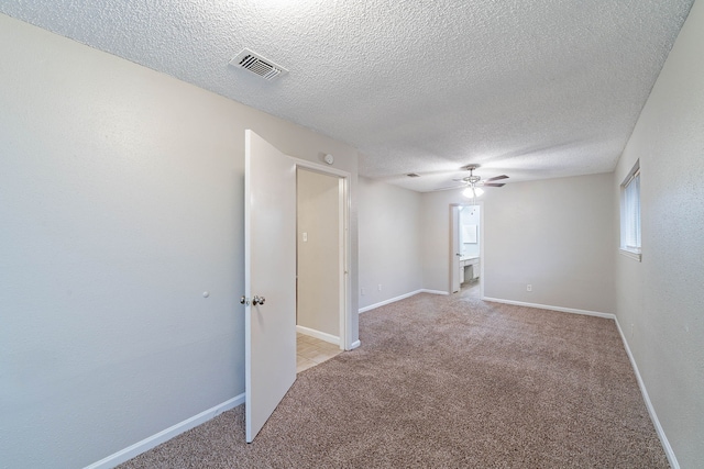 8006 Barnhill Dr, Humble, TX 77338 - unfurnished room featuring ceiling fan, a textured ceiling, light carpet, and baseboards
