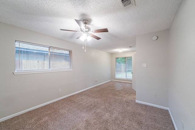 8006 Barnhill Dr, Humble, TX 77338 - spare room with ceiling fan, carpet, a textured ceiling, baseboards, and a smoke detector