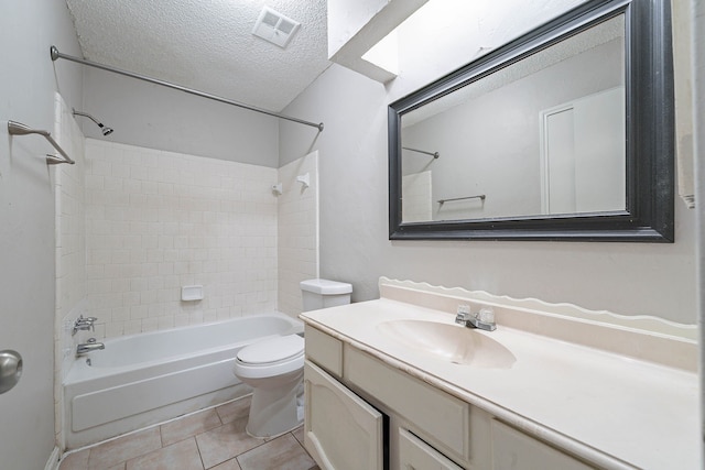 8006 Barnhill Dr, Humble, TX 77338 - bathroom featuring a textured ceiling, bathtub / shower combination, vanity, toilet, and tile patterned flooring