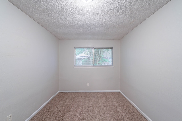 8006 Barnhill Dr, Humble, TX 77338 - carpeted empty room featuring a textured ceiling and baseboards