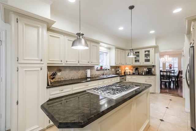 602 Rock Cv, Houston, TX 77079 - kitchen with a sink, a kitchen island, appliances with stainless steel finishes, plenty of natural light, and recessed lighting