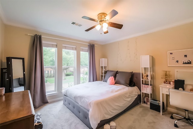 602 Rock Cv, Houston, TX 77079 - bedroom with light carpet, ornamental molding, a ceiling fan, and a desk